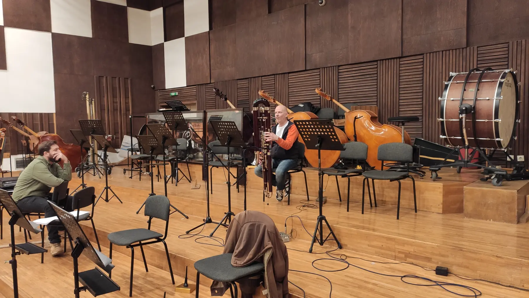 Musicians and instruments arranged in a recording hall